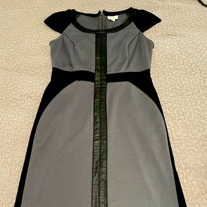 Cap sleeve shift dress stylish leather detail.